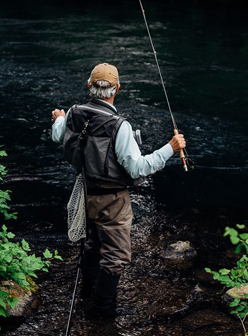 Photo of older man fishing