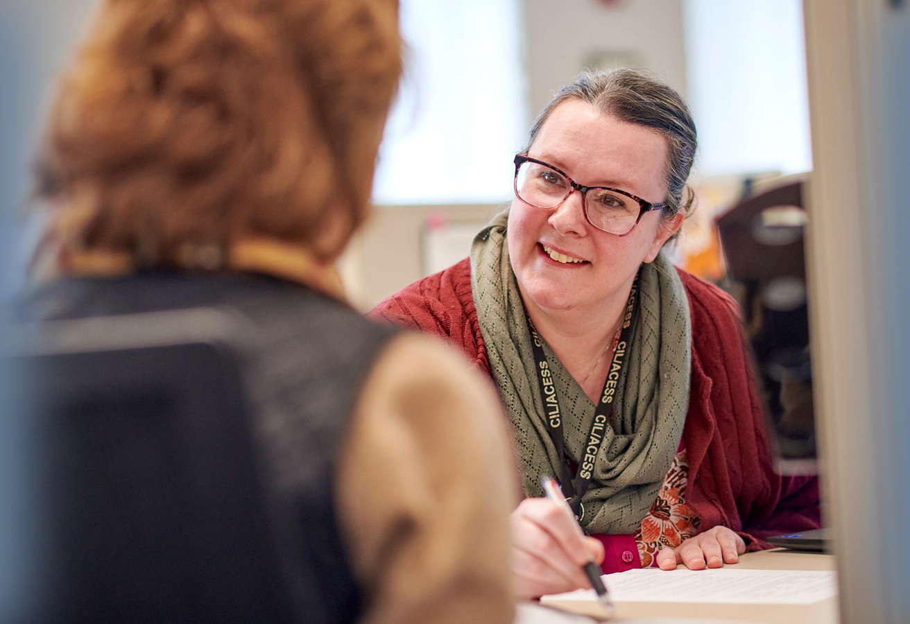 ACES$ Alabama caregiver hugging a teen boy with developmental disabilities
