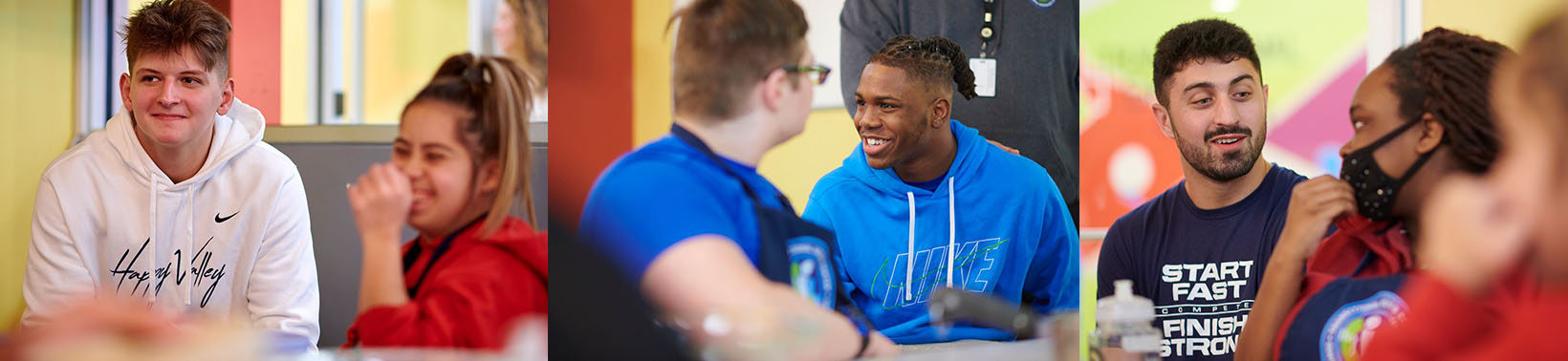 PSU players visiting with TSC students in the kitchen