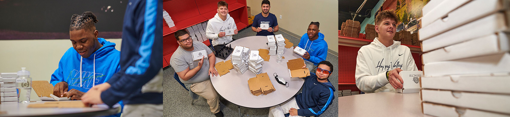 PSU players constructing boxes with TSC students