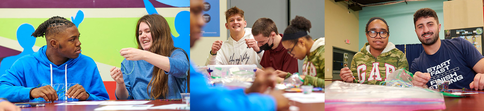 PSU players making bracelets with TSC students