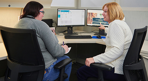 MyCIL independent Living Specialist consulting with a person with a disability 