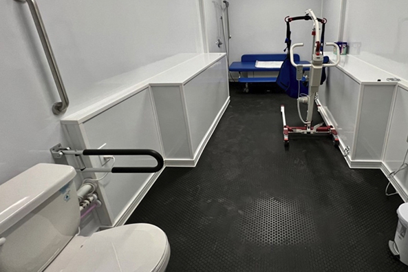 The inside of the mobile changing unit designed to make outdoor events more accessible for people with disabilities