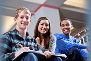 a group of teens smiling