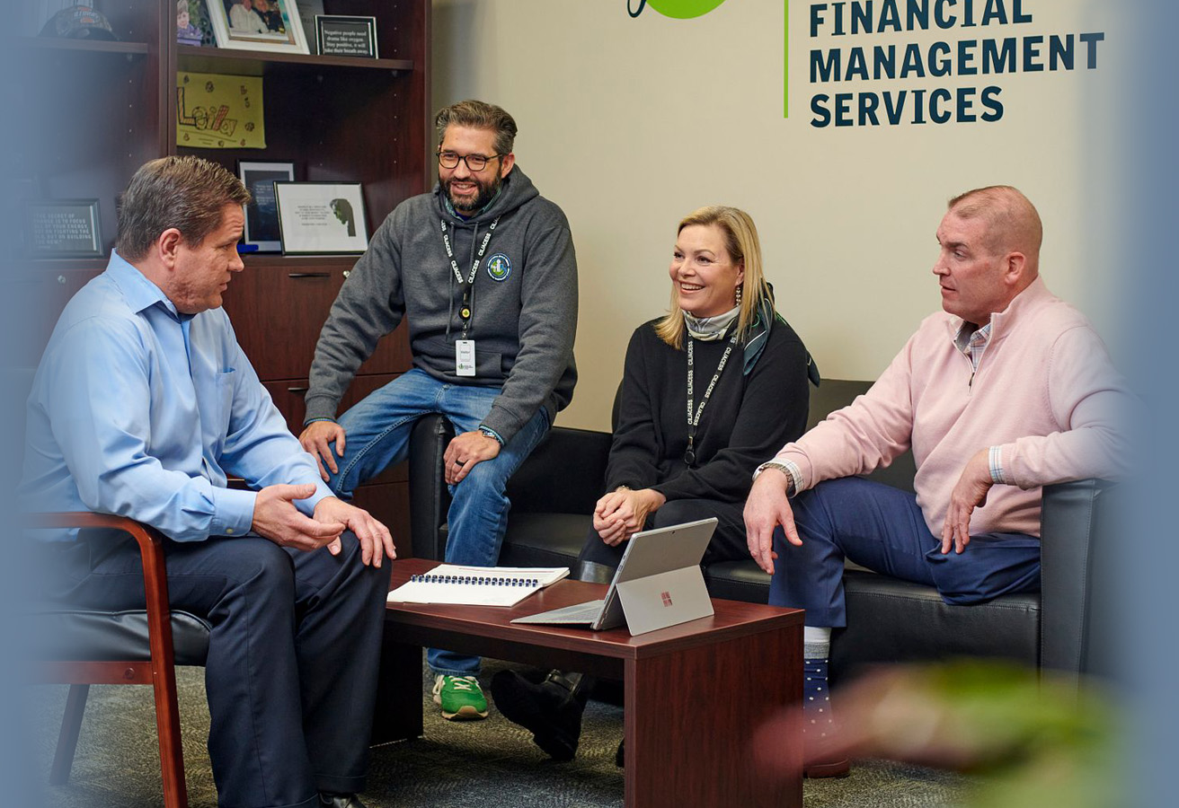 ACES$ Alabama caregiver hugging a teen boy with developmental disabilities